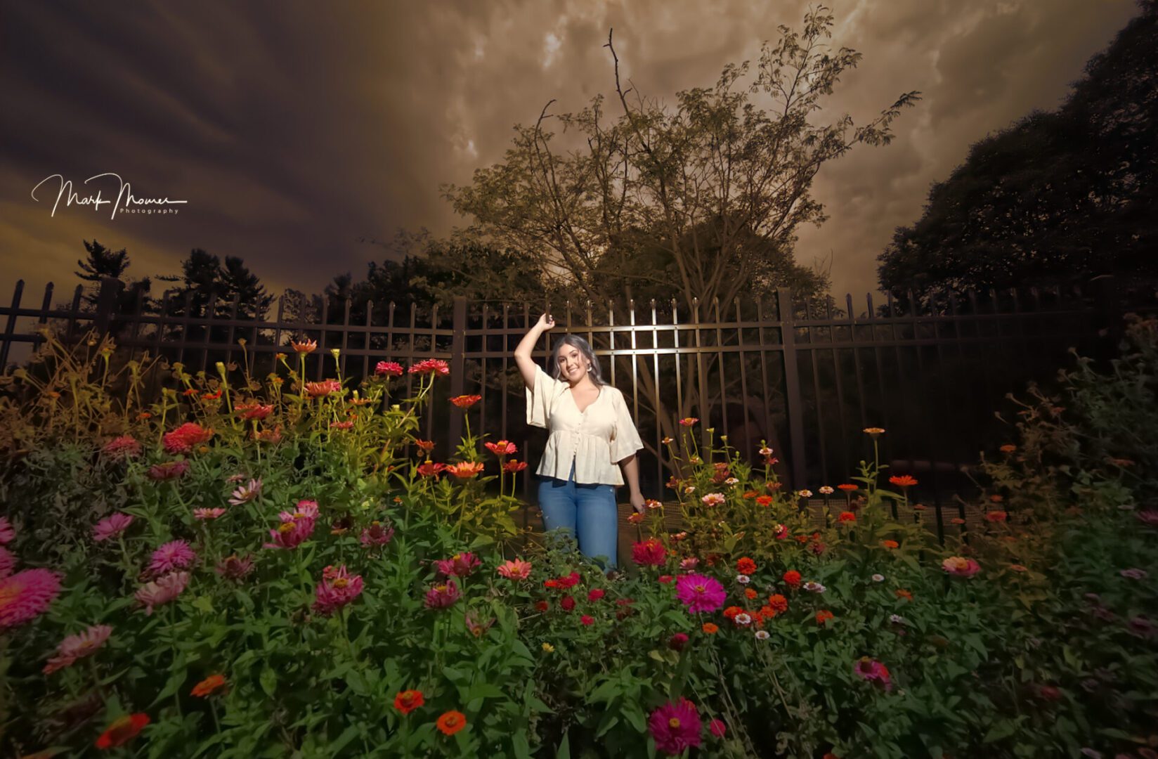 Senior picture at Hartwood Acres with dramatic sky