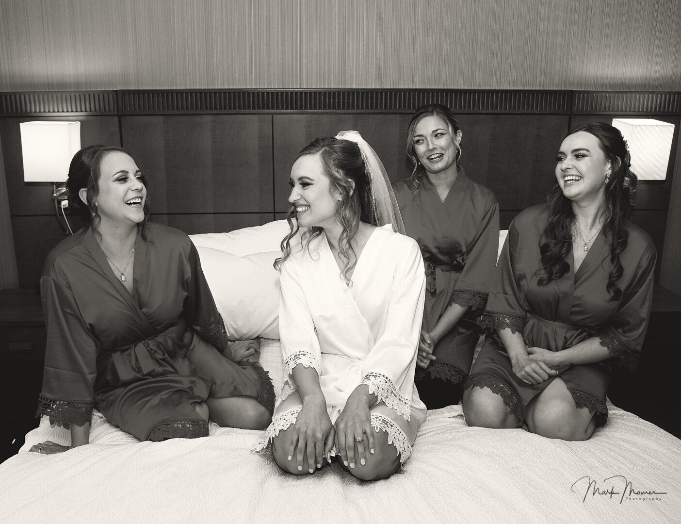 Bride and the bridesmaids enjoying time laughing