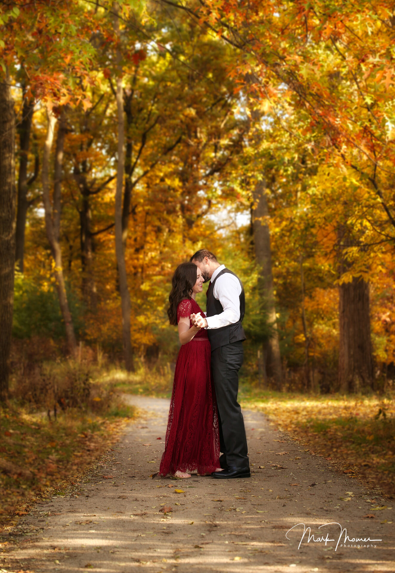beautiful fall portrait in the forest with a couple in love