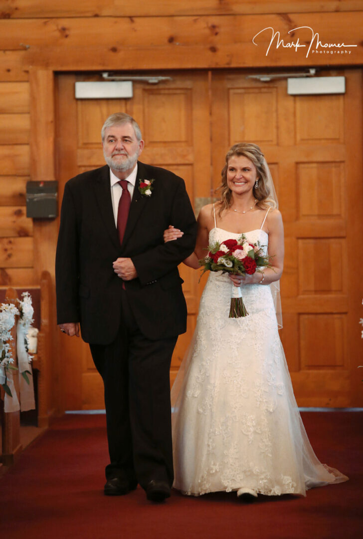 bride walking down the aisle with her father