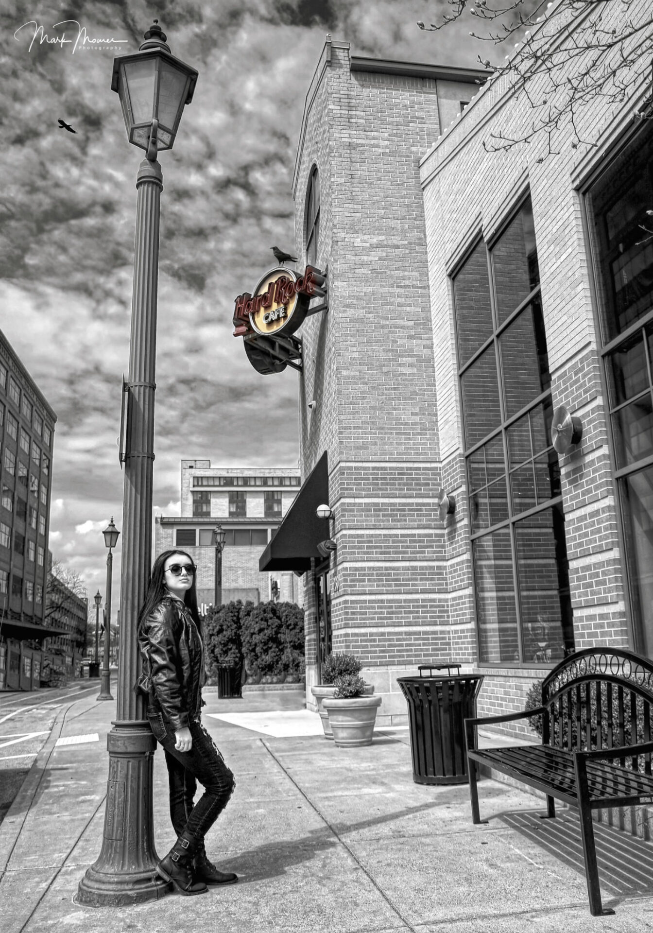 young lady standing in front of the hard rock cafe