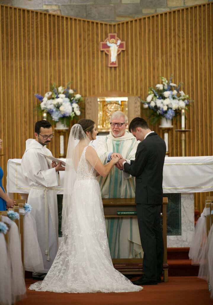 bride and groom saying their vows during their wedding ceremony